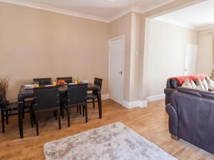 a dining room with a table and chairs at Field View in Saltburn-by-the-Sea