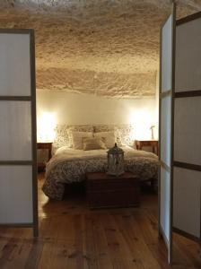 Posteľ alebo postele v izbe v ubytovaní Gite des Perreyeurs - maison troglodyte avec vue sur Loire