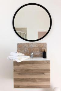a bathroom with a sink and a mirror at Cradock Guest House in Cradock