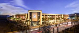 a large building with a street in front of it at DoubleTree By Hilton Izmir Airport in İzmir