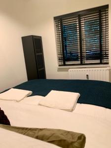 En eller flere senge i et værelse på Rode Bosuil: thuiskomen op De Veluwe!