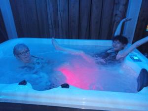 two people are in a hot tub in at Roul Poul in Malbrans