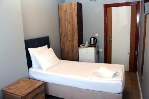 Postel nebo postele na pokoji v ubytování biglife hotel