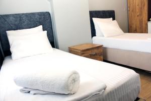 Postel nebo postele na pokoji v ubytování biglife hotel