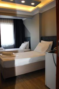 Postel nebo postele na pokoji v ubytování biglife hotel