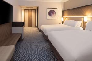 Postel nebo postele na pokoji v ubytování Hilton Glasgow