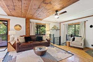 a living room with a couch and a table at Banner Barn in Banner Elk