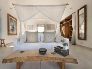 Letto o letti in una camera di Villa Santorini