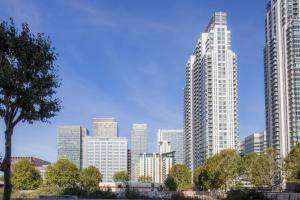 a view of a city skyline with tall buildings at Hilton London Canary Wharf in London