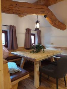 a wooden table and chairs in a room at Aignerhof in Flachau +38 photos