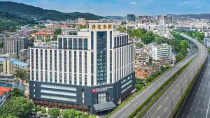 an aerial view of a building in a city at Hilton Garden Inn Guangzhou Tianhe- Free Canton Fair Shuttle Bus in Guangzhou