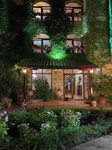 a house with a green lights on the front of it at Oleander House and Tennis Club in Sunny Beach