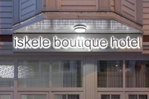 a sign that reads isle boutique hotel on top of a building at Pi Art Butik Otel in Istanbul