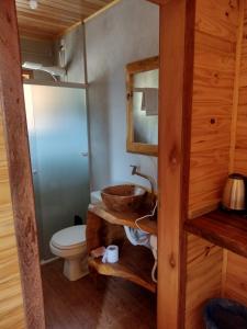 a bathroom with a sink and a toilet at HOSPEDAGEM CK in Urubici