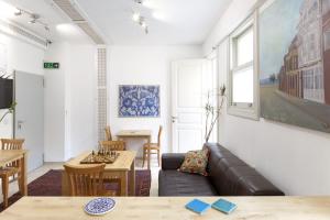 a living room with a couch and a table at Pi Art Butik Otel in Istanbul