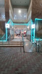 a lobby with blue lights in a building at Luluat Al sharq Al Awsat in Makkah