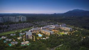 an aerial view of a city with a resort at Hilton Wenchang in Wenchang