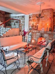 a living room with a table and a fireplace at Dar Bakkali Nadi in Tangier