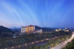 a view of a city at night with lights at Hilton Huizhou Longmen Resort in Huizhou