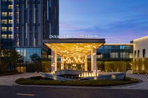a building with a gazebo in front of it at Doubletree By Hilton Kunming Airport in Kunming