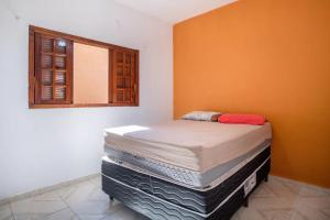 Cama ou camas em um quarto em PARAISO DO ALEXANDRE para 15 hóspedes
