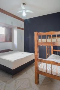 Cama ou camas em um quarto em PARAISO DO ALEXANDRE para 15 hóspedes