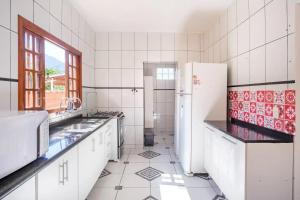 A cozinha ou cozinha compacta de PARAISO DO ALEXANDRE para 15 hóspedes