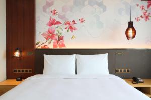 Postel nebo postele na pokoji v ubytování Hilton Garden Inn Zhuhai Hengqin