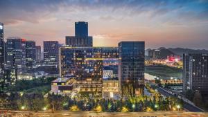 a view of a city at night at Hilton Guiyang in Guiyang