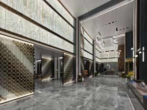 a lobby of a hotel with a large wall of mirrors at DoubleTree by Hilton Qidong in Qidong
