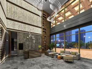 a lobby of a building with a view of a city at DoubleTree by Hilton Qidong in Qidong