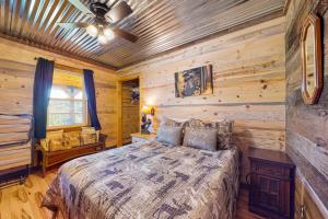 a bedroom with a bed and a ceiling fan at Great Smoky Hideout in Gatlinburg