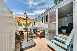 an outdoor patio with a table and an umbrella at Low-Key Poway Home about 20 Mi to La Jolla and San Diego in Poway