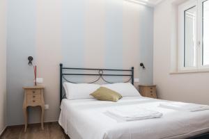 Postel nebo postele na pokoji v ubytování Borgo Fe'