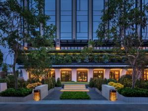 una representación de la parte delantera de un edificio con jardín en Waldorf Astoria Xiamen, en Xiamen