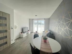 a dining room with a table and chairs at B144 Design Lux Apartments #FreeParking in Budapest