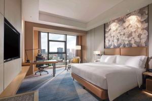 Postel nebo postele na pokoji v ubytování Doubletree By Hilton Yangzhou