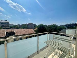 a balcony with a bench and a view of the city at B144 Design Lux Apartments #FreeParking in Budapest