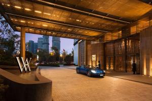 a blue car parked inside of a building at Waldorf Astoria Chengdu in Chengdu