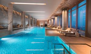 a large swimming pool in a hotel lobby at Waldorf Astoria Chengdu in Chengdu +73 photos