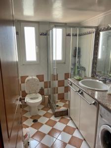 a bathroom with a toilet and a sink at Villa Marisia in Chios