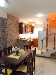 a kitchen and dining room with a table and chairs at Duplex Dorrego- Guaymallén in Guaymallen