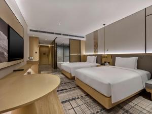 Postel nebo postele na pokoji v ubytování Doubletree By Hilton Beijing Badaling