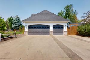 a house with a garage with a driveway at Soft Tail Sanctuary in Bend