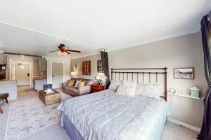 a bedroom with a bed and a living room at The Lodge at Tamarron #425 in Durango +48 photos