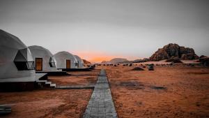 a group of domes in the middle of a desert at Bedouin oasis in Wadi Rum