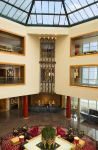 a view of the lobby of a building with a glass ceiling at Hilton Beijing in Beijing
