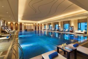 a large swimming pool in a hotel lobby at Hilton Changzhou in Changzhou