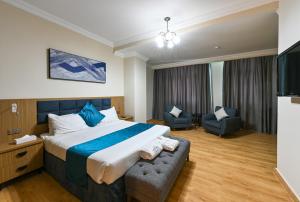 Voodi või voodid majutusasutuse Saray Musheireb Hotel Suites and Apartment toas