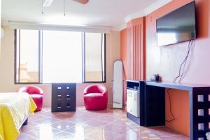 Televiisor ja/või meelelahutuskeskus majutusasutuses Hostal Antares